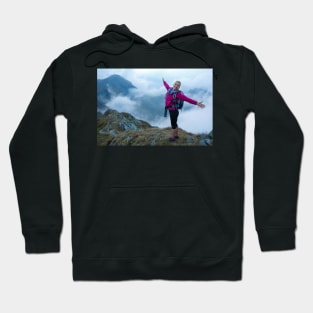 Woman backpacker hiking on a trail Hoodie